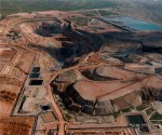 Historic photo shows where mining stopped in 1996 with the pit confined by infrastructure. The photo also shows a portion of the heap leach pads, waste dumps and tailings pond. 2007 drilling returned high-grade intercepts where the mill building had been located.