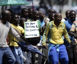 Lonmin profit keeps hurting by platinum strike, two workers reportedly killed