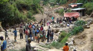 Congo gold miners scour rubble for bodies after cave-in