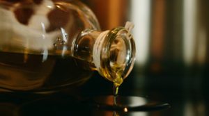 Vegetable oil pouring from bottel