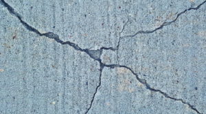 Cracked pavement.