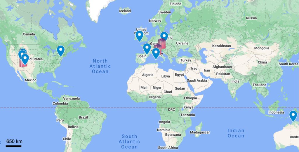 Mapa de nuevas localidades pronosticadas de especies minerales U seleccionadas, rutherfordina, andersonita, schröckingerita, bayleyita y zippeita.  Las ubicaciones verificadas en tierra a partir de octubre de 2021 están marcadas con un logotipo de Mindat, mientras que las localidades no verificadas se indican con un marcador.