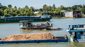 Boat carrying sand on the Xáng Canal in Vietnam's An Giang Province