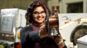 PNNL researcher Keerti Kappagantula holds highly conductive copper wire in bulk