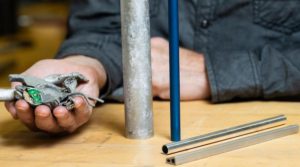 Post-consumer recycled aluminum scrap transformed into new building materials.